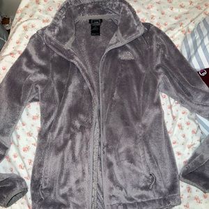 grey fuzzy north face jacket